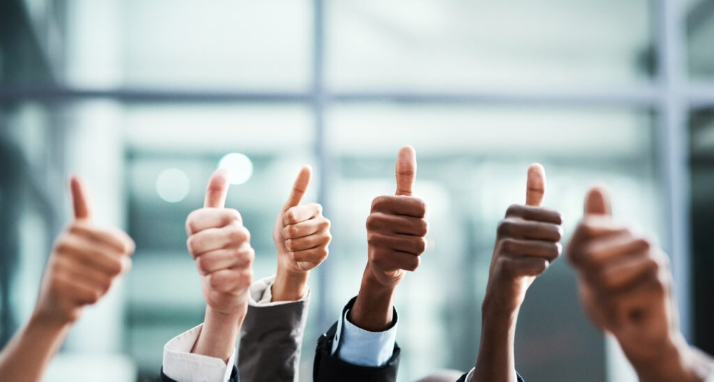 Winning, thumbs up and group of people thank you, support or teamwork hands for vote, yes or like emoji. Collaboration, target or winner women and men in business ok, diversity success or thanks sign.